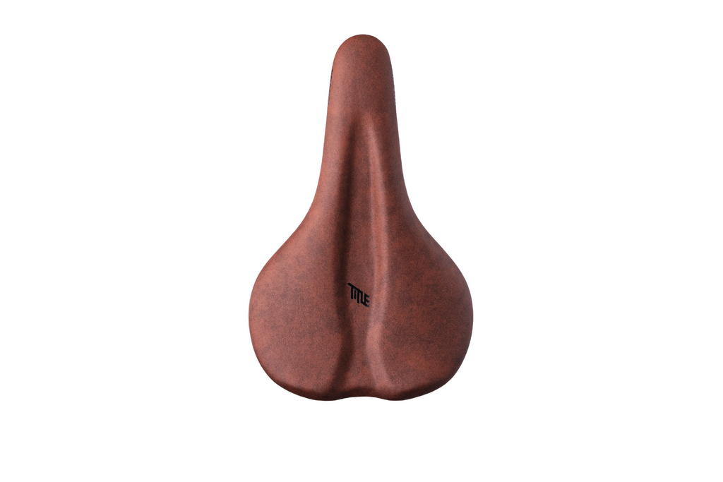 Title MTB ES1 Enduro Saddle in brown, shown on a white background. This performance mountain bike saddle features a seamless design for improved comfort and flexible platform, ideal for all-mountain and enduro riding