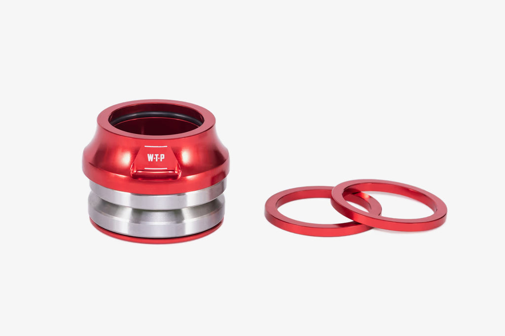 WeThePeople WTP Compact BMX headset in red with silver bearing races and red spacer rings on white background"