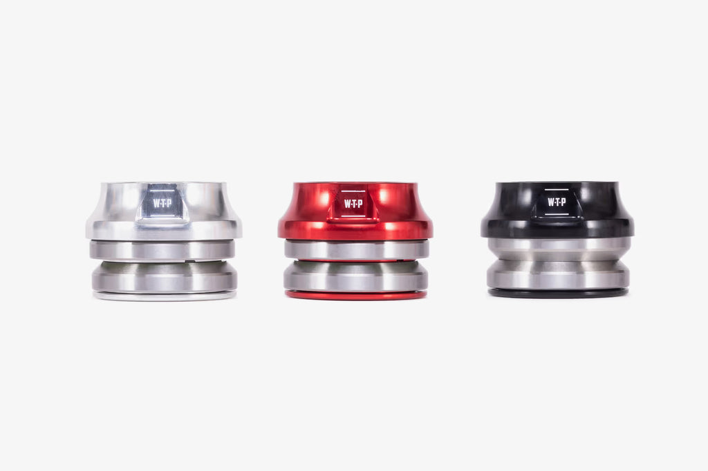 WeThePeople WTP Compact BMX headsets in three color options - silver, red, and black anodized finishes with integrated top caps on white background