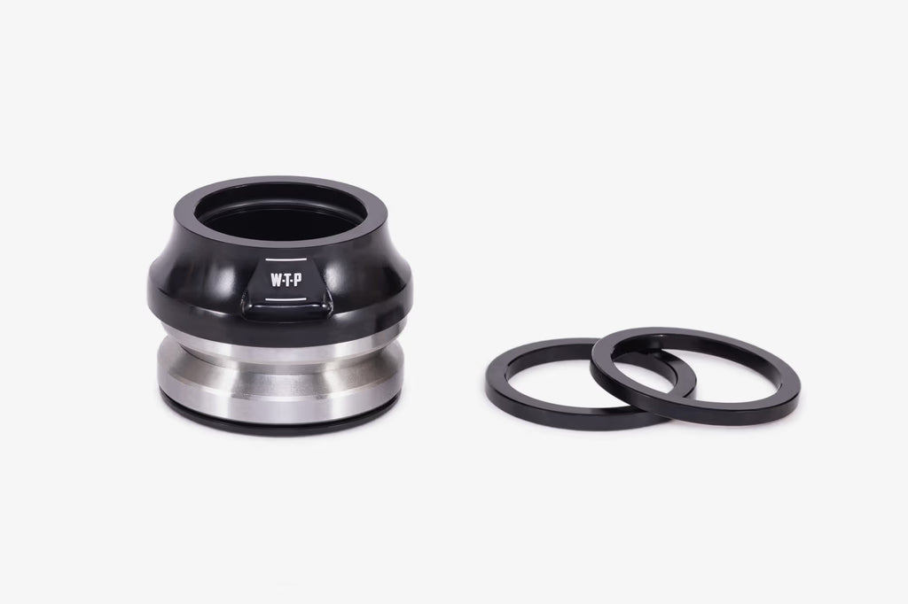 WeThePeople WTP Compact BMX headset in black with silver bearing races and black spacer rings on white background"