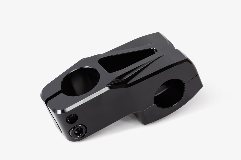 Black anodized aluminum bicycle stem shown from above, featuring WeThePeople branding, multiple hex bolt mounting points, and a hinged clamp design for handlebar attachmen