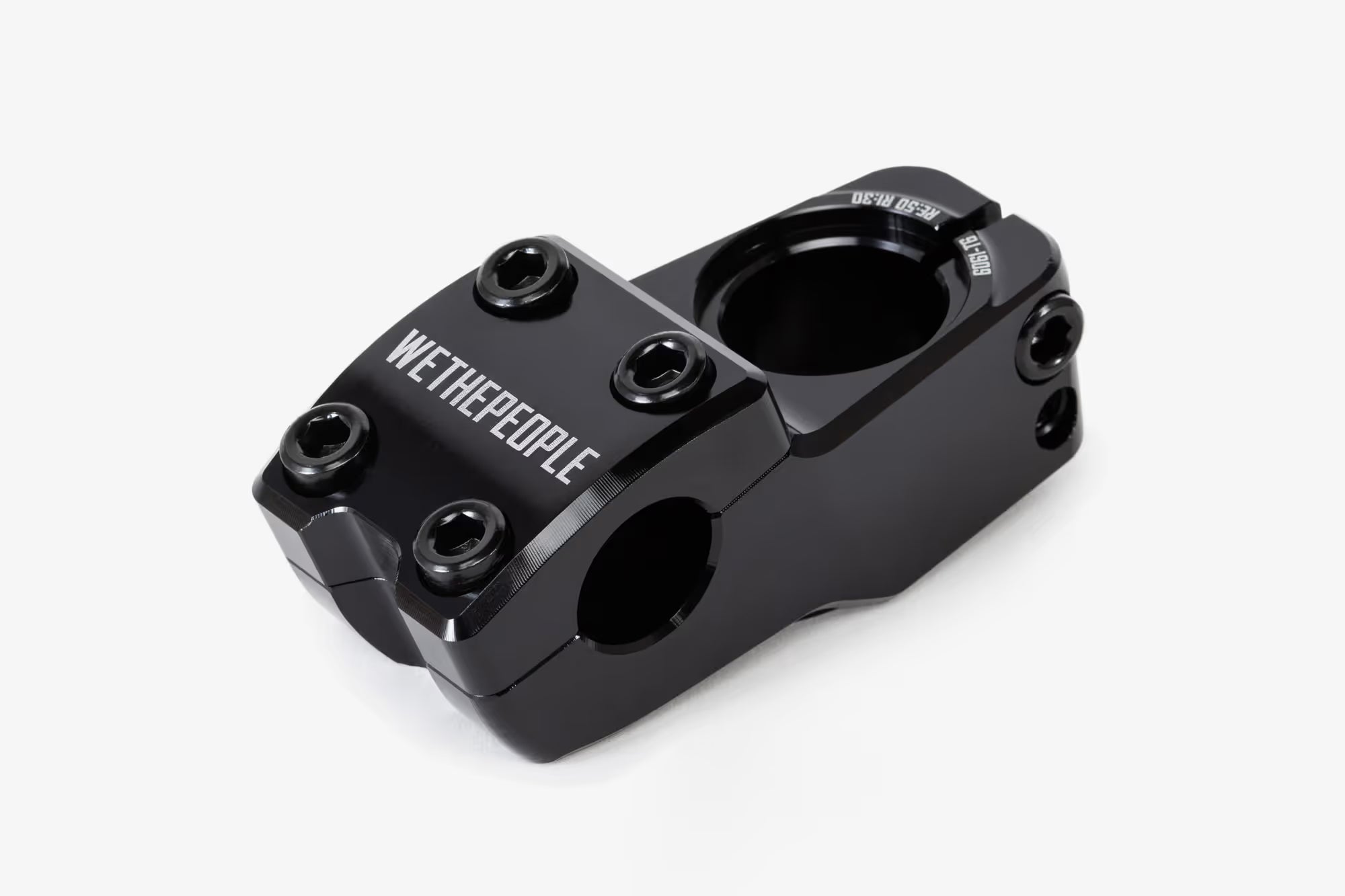Black anodized aluminum bicycle stem shown from above, featuring WeThePeople branding, multiple hex bolt mounting points, and a hinged clamp design for handlebar attachmen