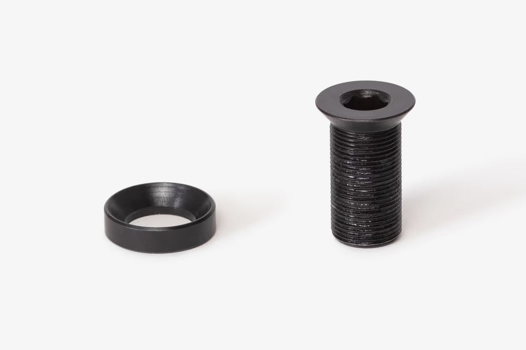 Black Eclat Tibia BMX crank bolt and conical washer set on a white background