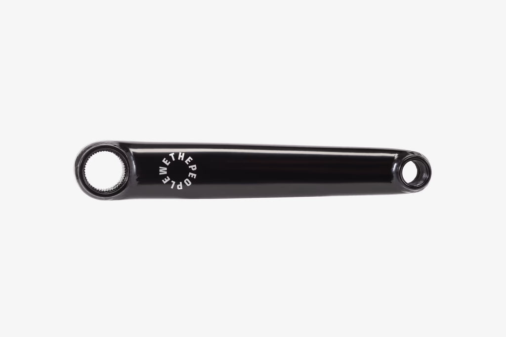 Wethepeople Logic BMX Crank Arm in Black, isolated on a white background. This robust 3-piece BMX crank is made from heat-treated 4130 Chromoly and is compatible with both left and right-hand drive setups