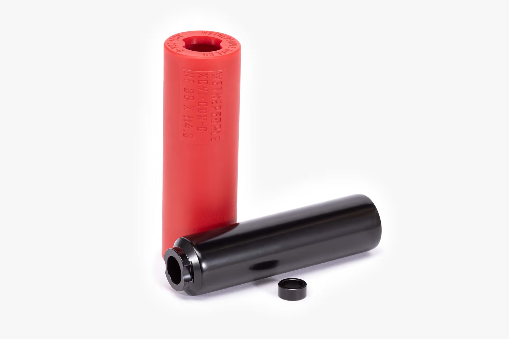 Wethepeople (WTP) Temper BMX Pegs, shown as a pair: one red nylon sleeve with branding and one black metal core, emphasizing the two-piece design and etched specifications.