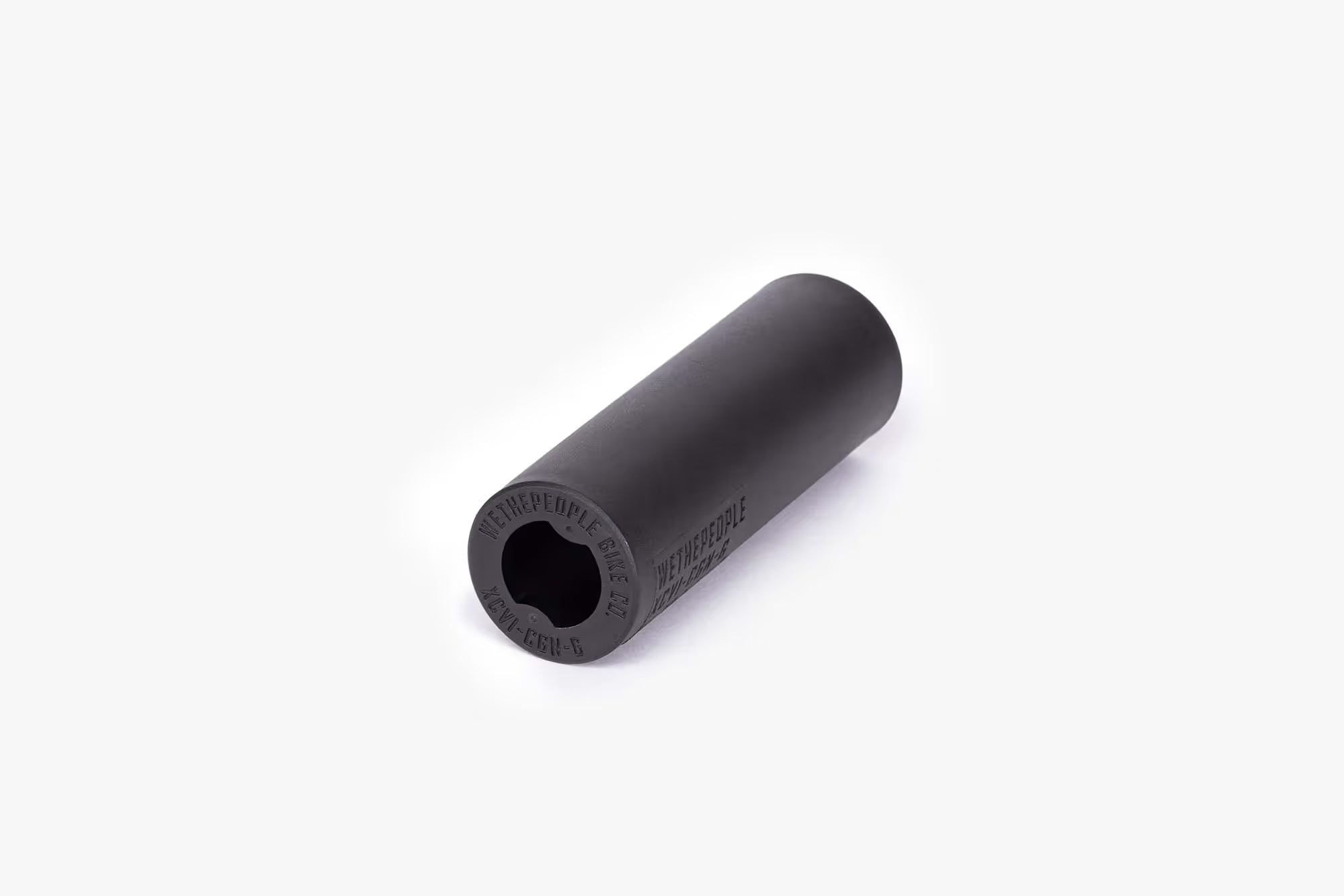 Single Wethepeople (WTP) Temper BMX Peg, black, showing the smooth nylon sleeve exterior and the hexagonal opening of the inner core.