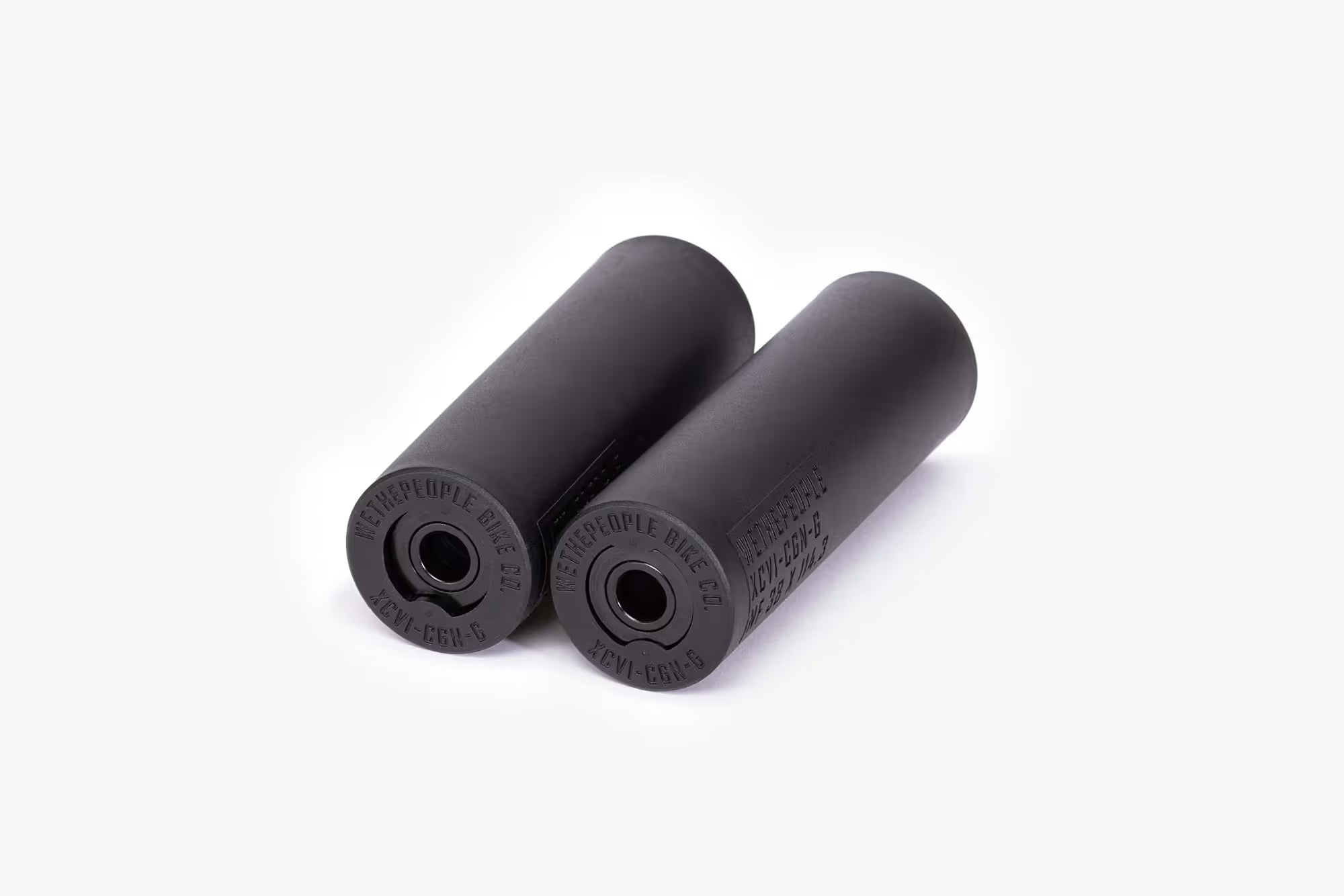 Pair of black WeThePeople Temper BMX pegs with nylon sleeves over chromoly core, designed for grinding and street riding.