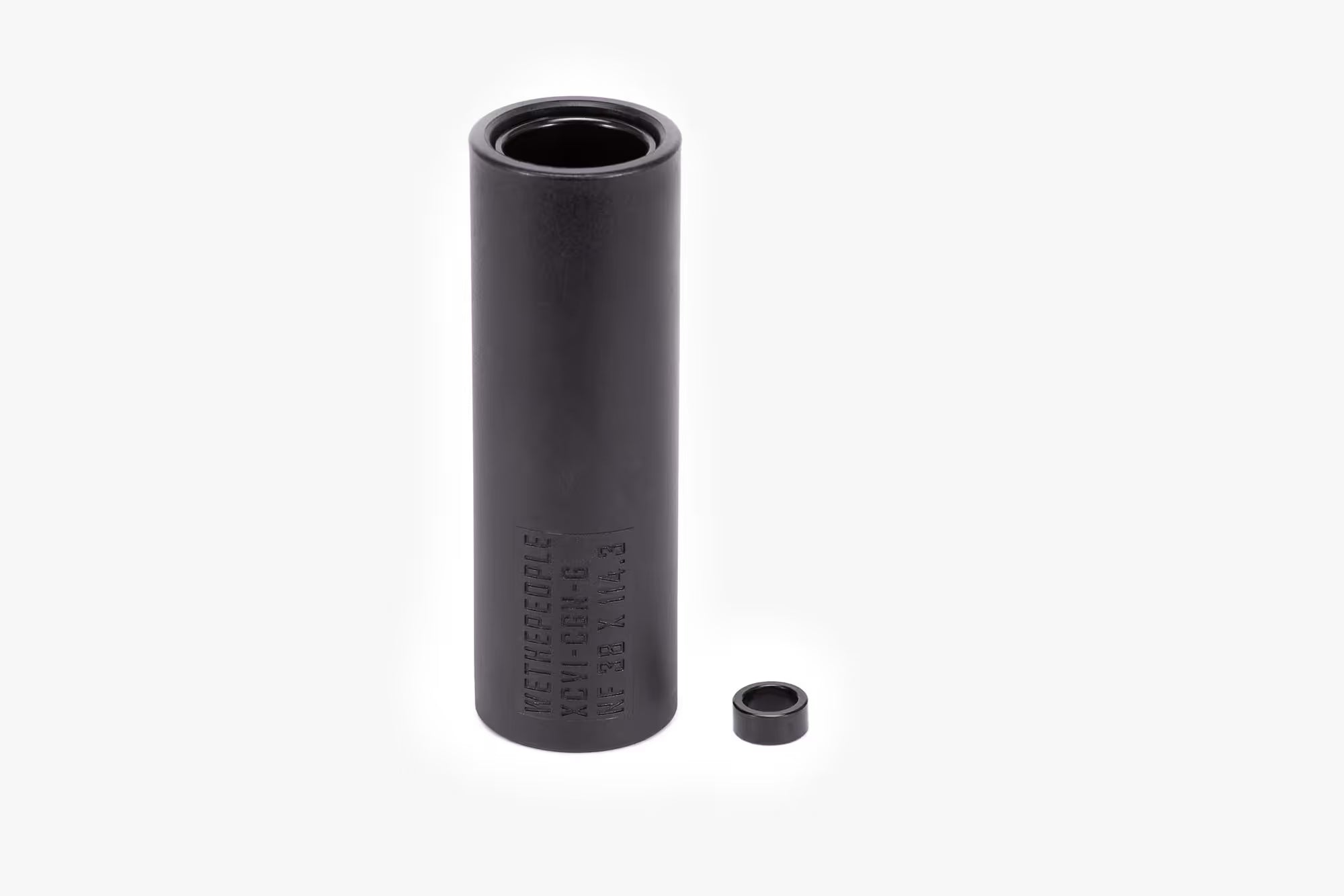 WETHEPEOPLE Temper BMX Peg in black, showing the 'XCVI-CG-G 20 32 X 114.3' model details, accompanied by a small metal washer/adapter