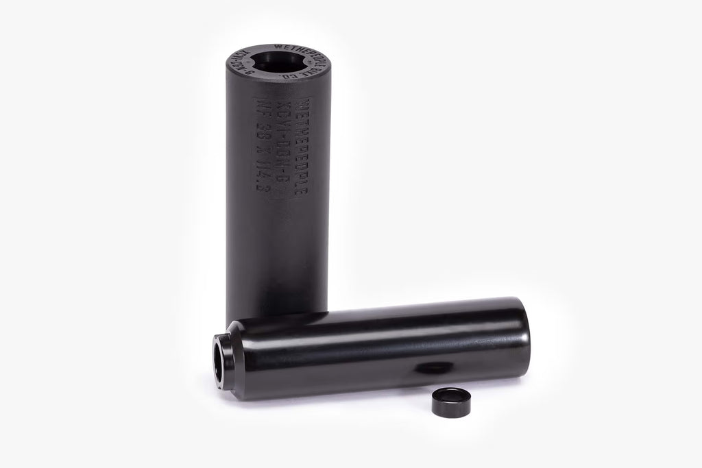 Pair of Wethepeople (WTP) Temper BMX Pegs, black, with the metal core visible, highlighting the laser-etched WETHEPEOPLE branding and technical specifications.