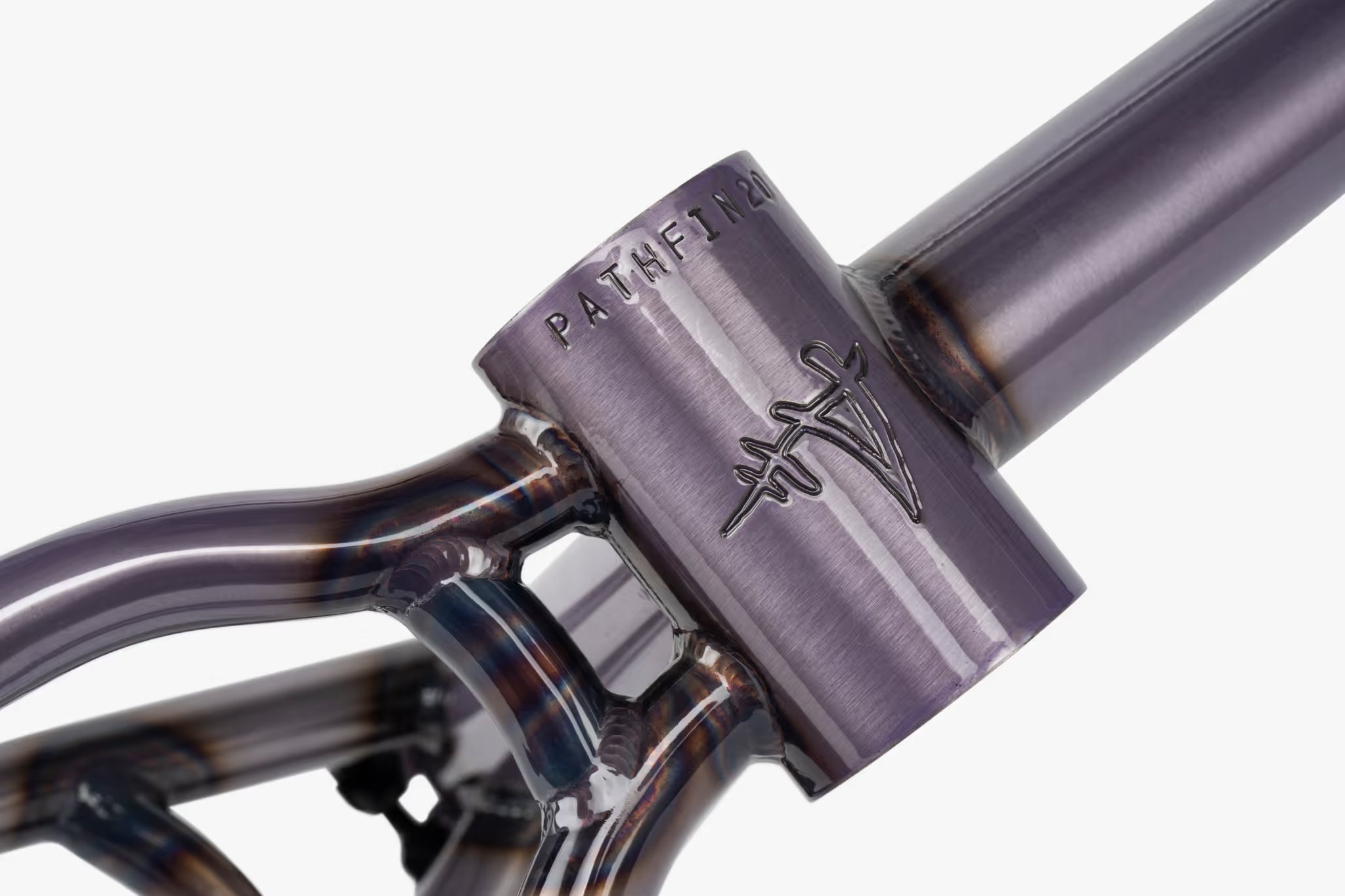 Close-up of a Wethepeople Pathfinder BMX frame's head tube and top tube, showcasing the raw or clear-coated metallic finish with visible weld details, and the distinctive Wethepeople 'W' logo with 'PATHFIN20' text debossed on the head tube