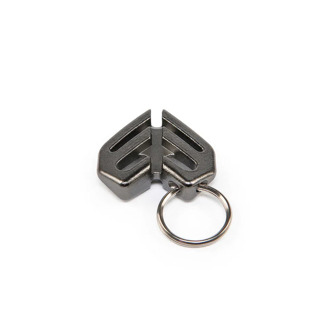 Éclat Key Chain (keyring) charm in a gunmetal black finish, featuring the Éclat logo design and an attached metal keyring.