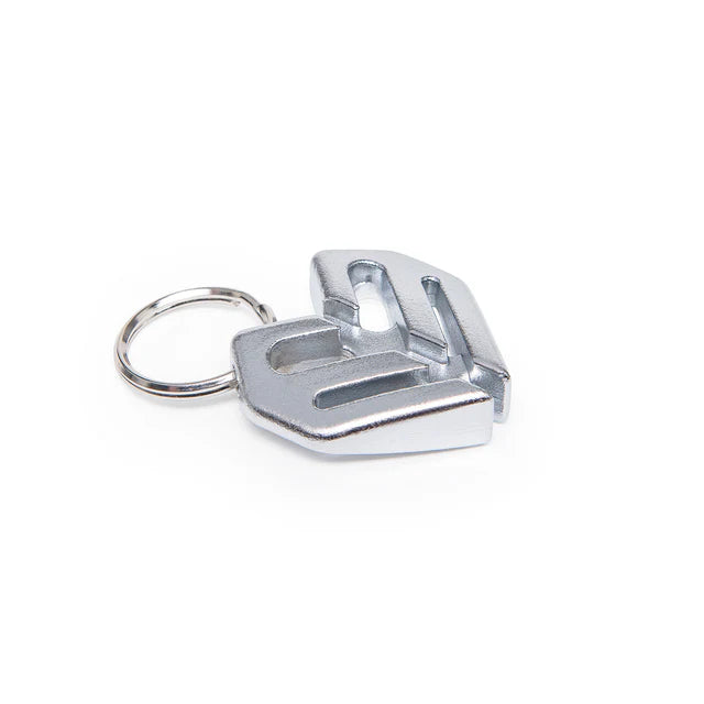 Éclat Key Chain (keyring) charm in a polished silver/chrome finish, shaped like the Éclat logo and attached to a metal ring.