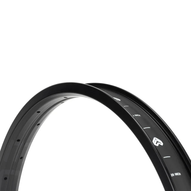 Close-up view of the Éclat Trippin double-wall BMX rim in stealth black, highlighting the internal graphics and 20 inch size text on the rim bed.