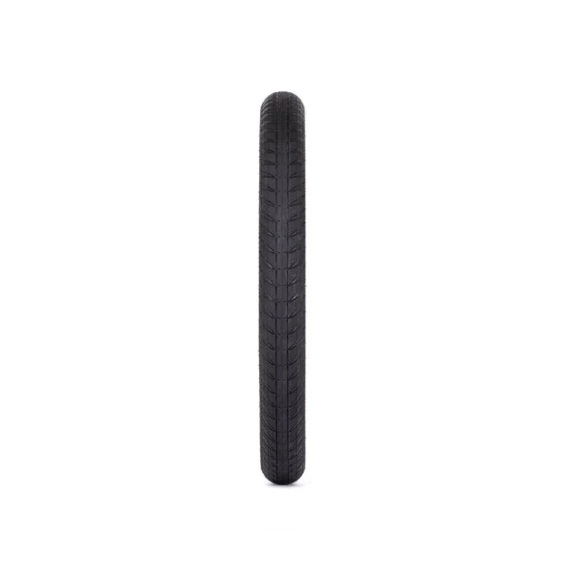 Éclat Creature BMX Tire, all-black, straight-on view highlighting the directional center tread for fast rolling speed.