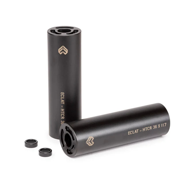 Pair of Éclat Dura BMX Pegs, black, shown with both HTCR 4140 steel pegs and their two small anti-rotation washers.