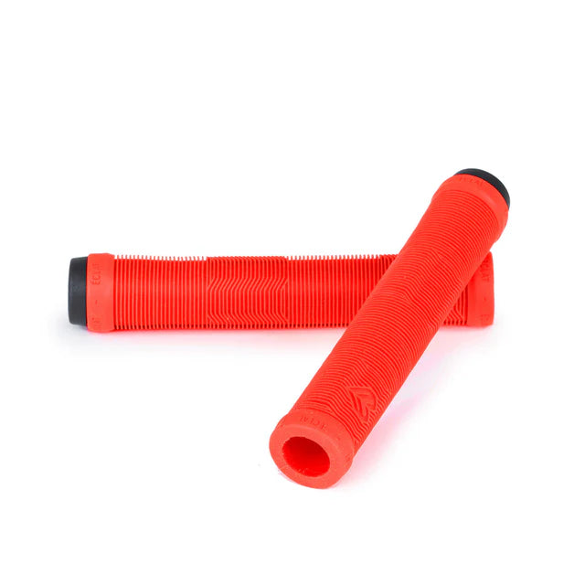 Pair of Éclat Pulsar BMX grips in vibrant neon red, shown angled with a ribbed tread pattern and black bar ends.