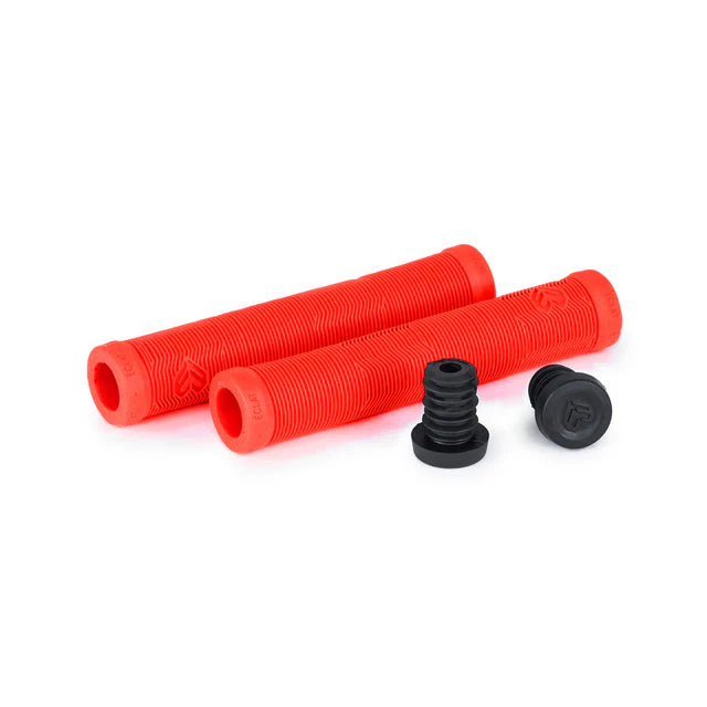 Éclat Pulsar BMX grips in neon red color, shown disassembled with the two black push-in bar ends included.
