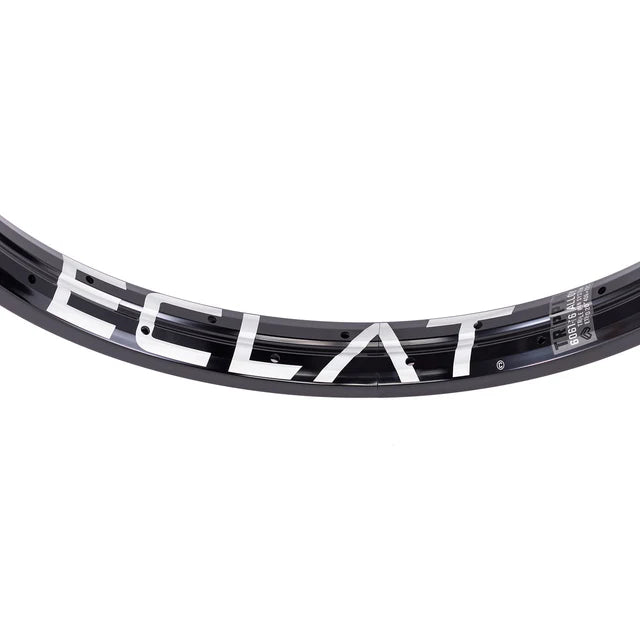 Close-up top view of the Éclat Trippin double-wall BMX rim in black, showcasing the bold white ÉCLAT logo and the technical decal.