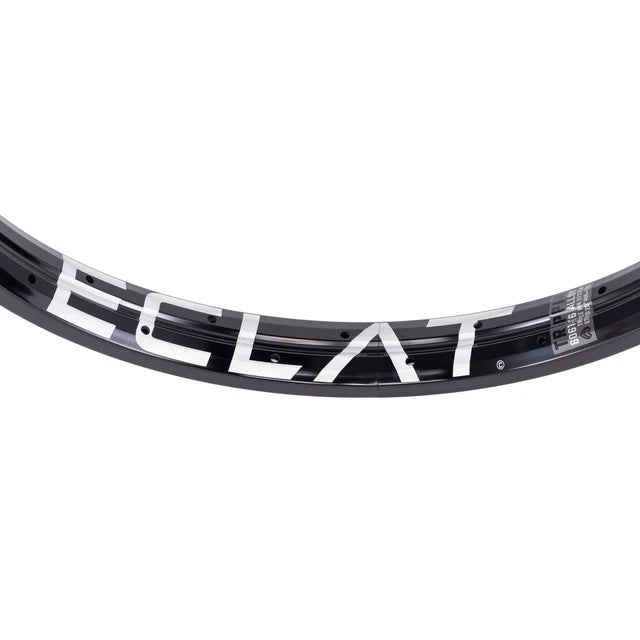 Close-up top view of the Éclat Trippin double-wall BMX rim in black, showcasing the bold white ÉCLAT logo and the technical decal detail.