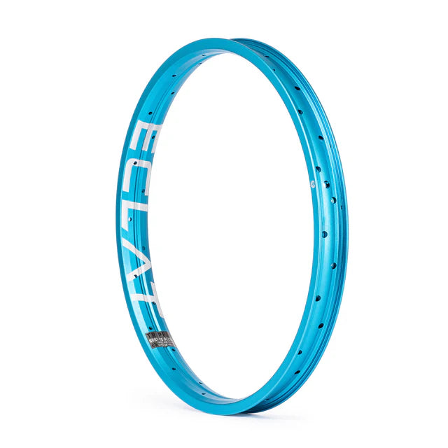Éclat Trippin double-wall BMX rim, sandblasted cyan (light blue) finish, angled view showing the bold ÉCLAT sidewall logo and spoke holes.