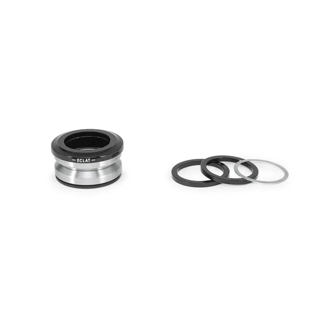 Éclat Wave 6 Integrated Headset, silver/polished bearings with black dust cover, disassembled, showing the bearings and the small spacer rings.