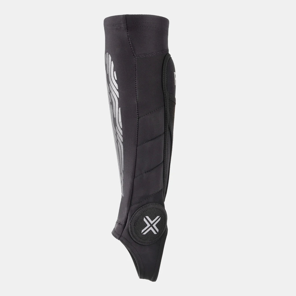 FUSE Omega Pro Shin Pad Combo, black, side view showing the calf muscle protection, graphic pattern, and the ankle protection pad with the white 'X' logo.
