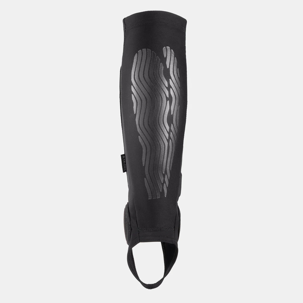 Back view of the FUSE Omega Pro Shin Pad Combo, black, showing the silicone print or grip pattern on the back of the calf and the ankle loop.