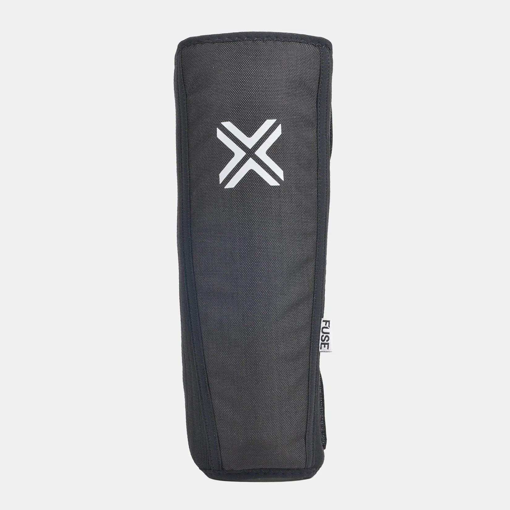 FUSE Alpha Shin Pad, a single dark gray/black pad, viewed straight-on, highlighting the large white FUSE 'X' logo and the durable cover material.