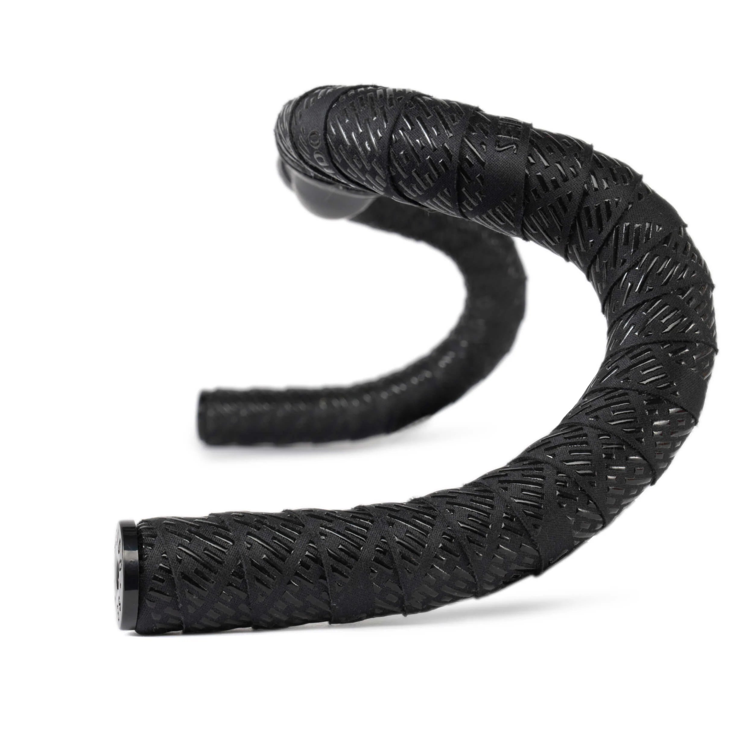 SEIDO TAB Handlebar Tape, black, shown wrapped around drop bars, highlighting the laser-cut diamond pattern for enhanced grip and texture.