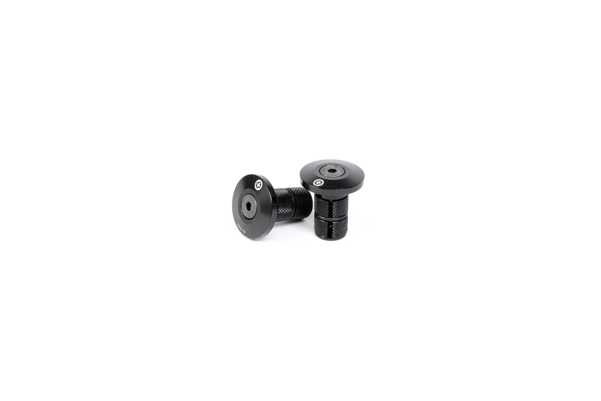 Pair of SALTPLUS HQ CNC Bar Ends, black, shown disassembled, highlighting the metal body and the knurled compression fitting for secure installation.