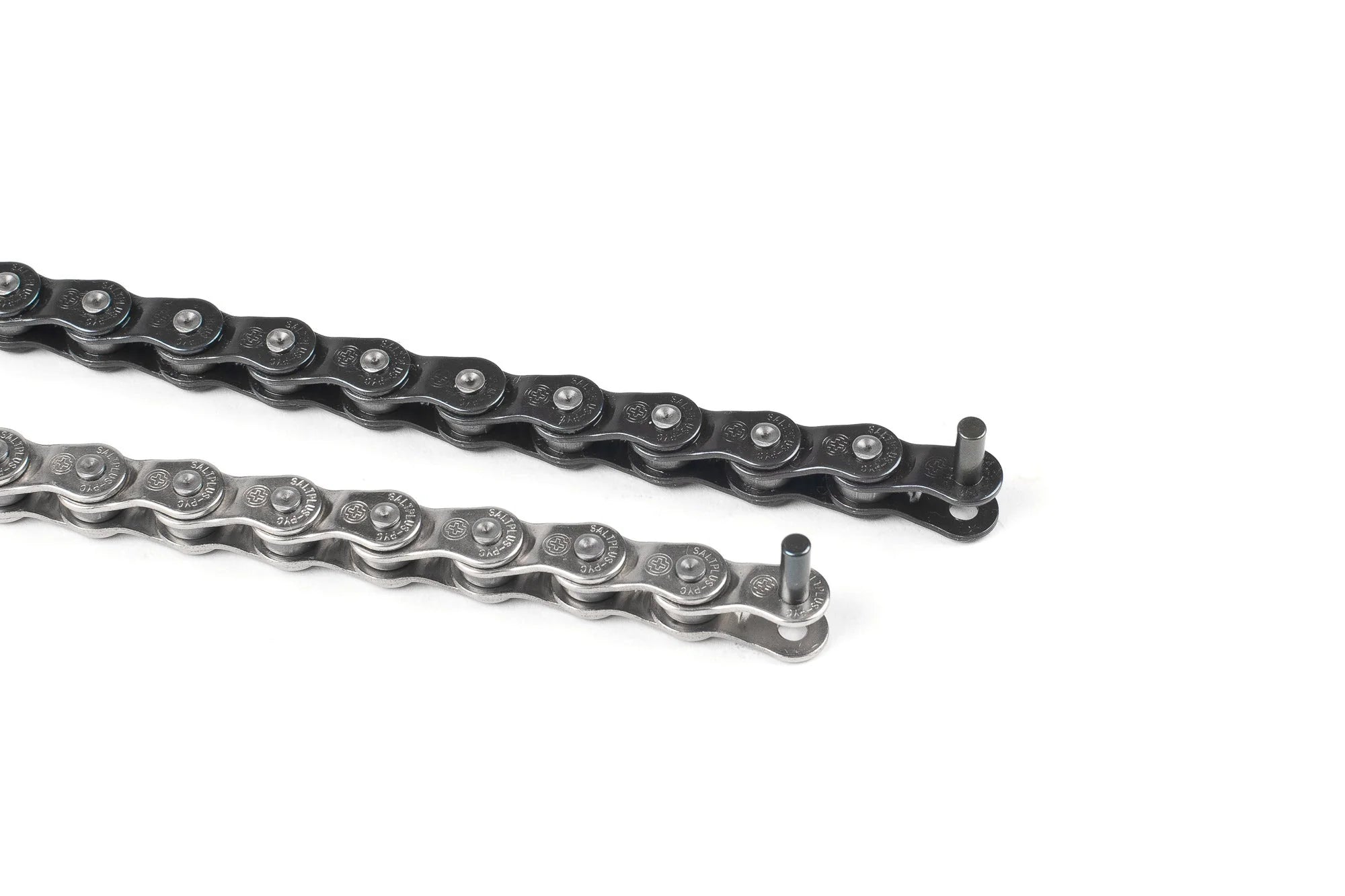 Comparison of two SALTPLUS Warlock half-link BMX chains, showing the black finish (top) and polished silver finish (bottom), with an extended pin ready for installation.
