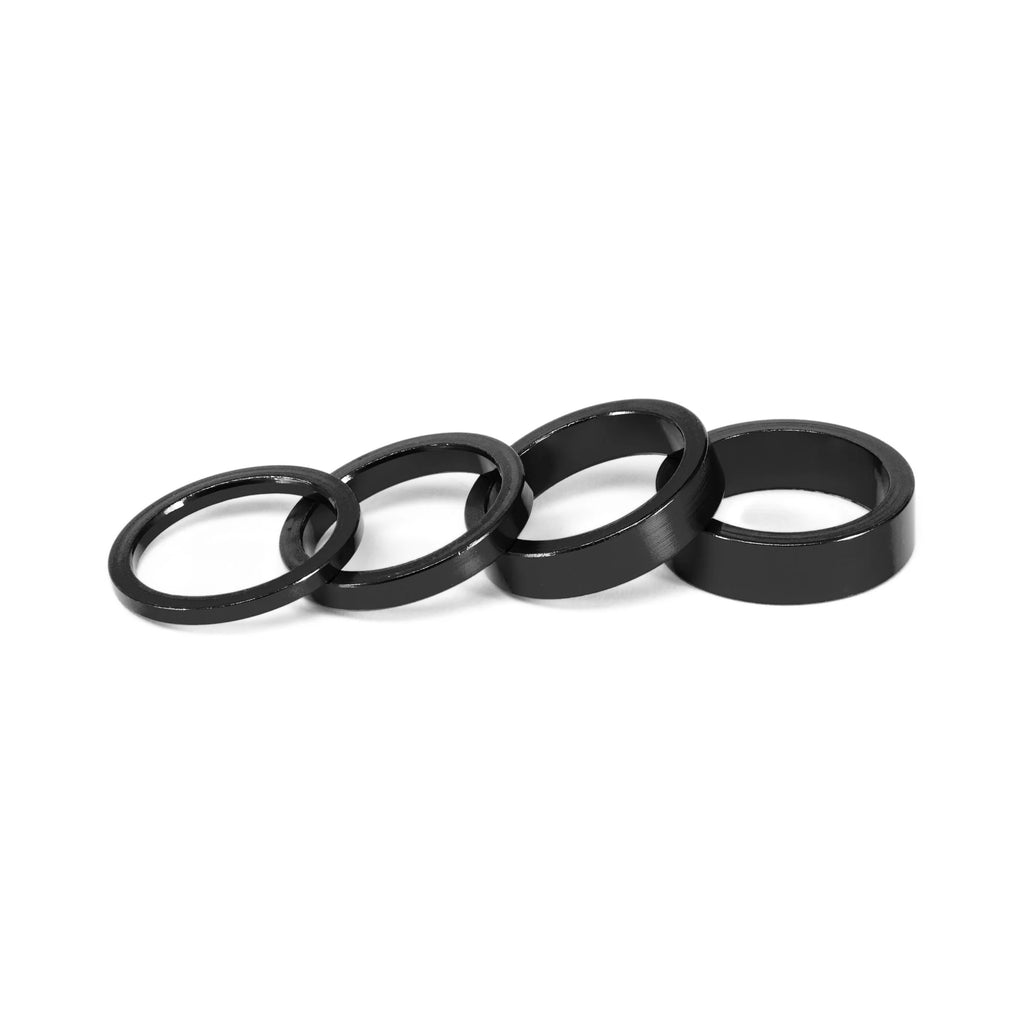 SALT BMX Headset Spacers set, black, including four different sizes of thin rings for headset stack height adjustment.