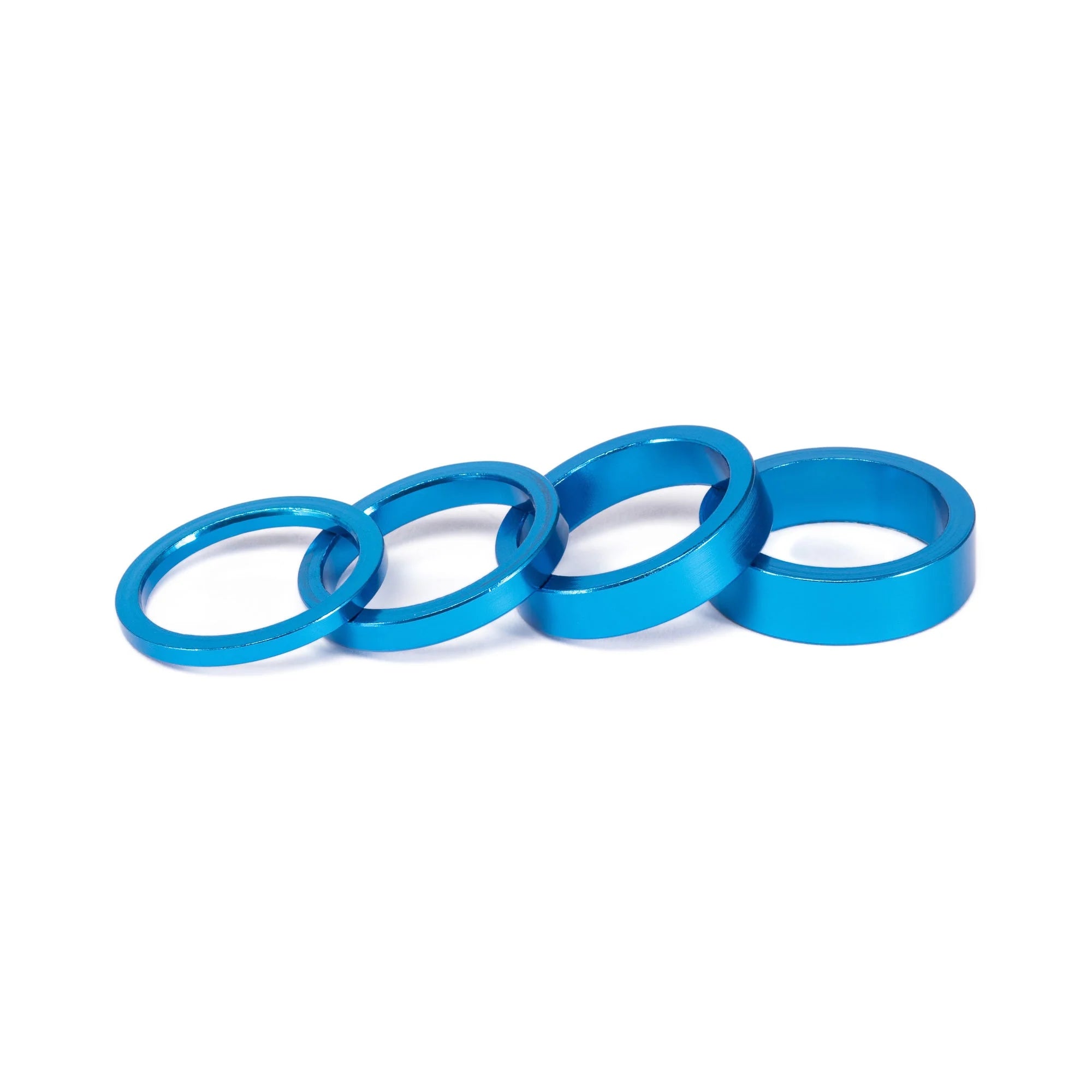 SALT BMX Headset Spacers set, featuring four different sizes of rings in a vibrant blue (anodized) finish for adjusting stem stack height.
