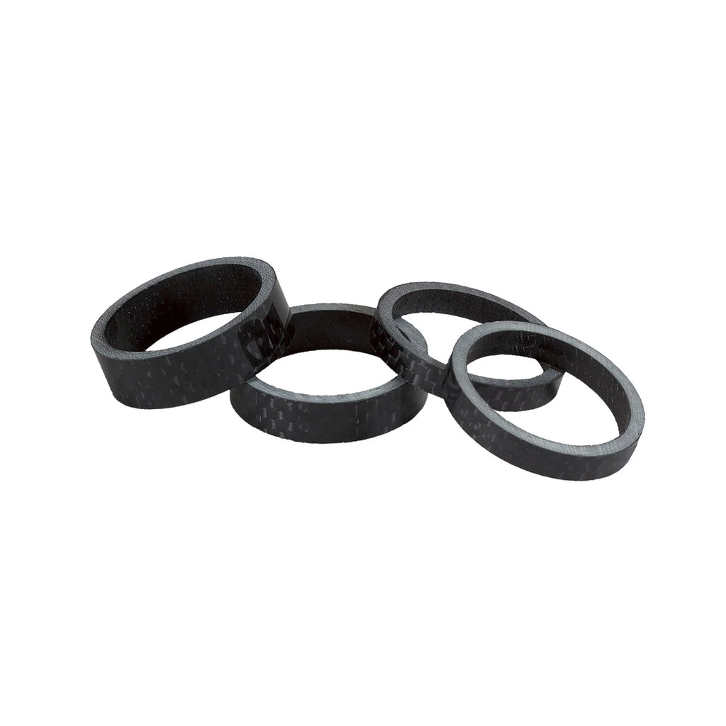 SALT BMX Headset Spacers set, featuring four rings in a carbon fiber look, used to adjust bike stem height.