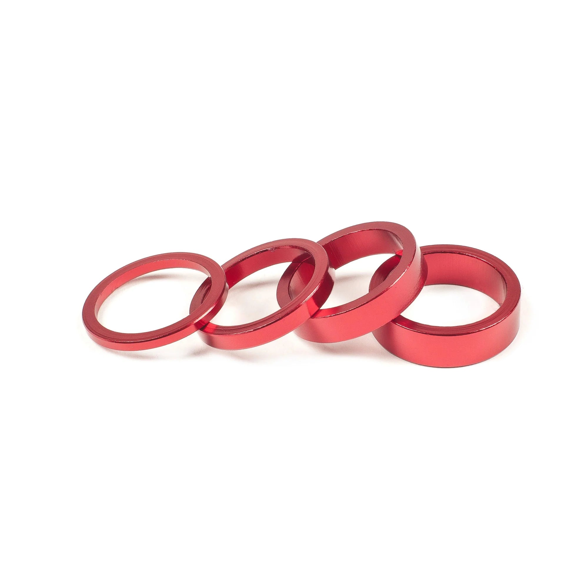 SALT BMX Headset Spacers set, featuring four different sizes of rings in a vibrant red finish for adjusting stem stack height.
