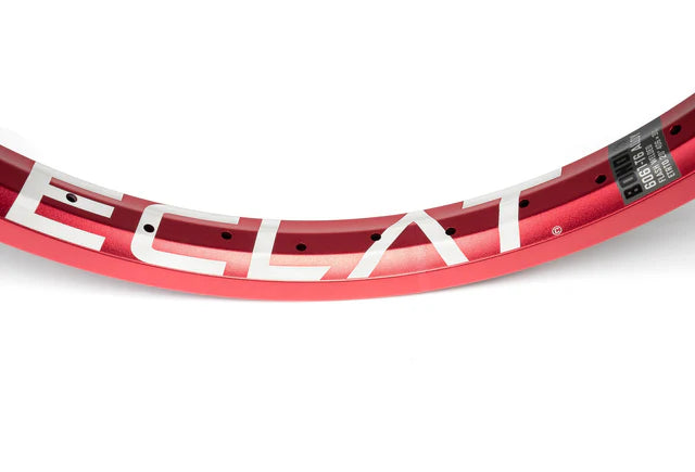 Close-up top view of the Éclat Bondi straight-wall BMX rim in sandblast red finish, showcasing the bold white ÉCLAT logo and spoke holes.