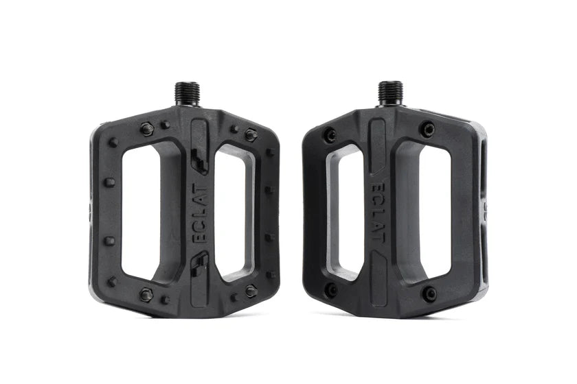 Two black bicycle pedals on a white background