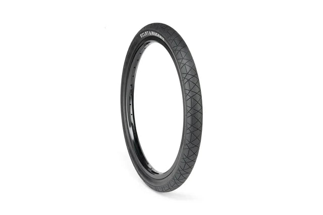 Éclat Mugen BMX Tire, 1.75" narrow width, all-black, angled view highlighting the street tread pattern and MUGEN sidewall branding.