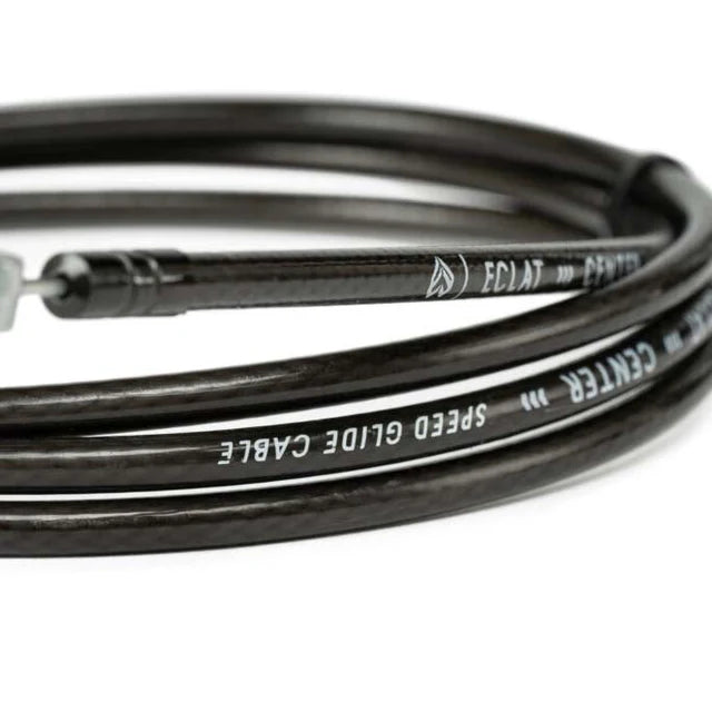 Close-up view of the Éclat 'The Center' Linear BMX Brake Cable in black, highlighting the SPEED GLIDE CABLE and ÉCLAT THE CENTER branding on the housing.