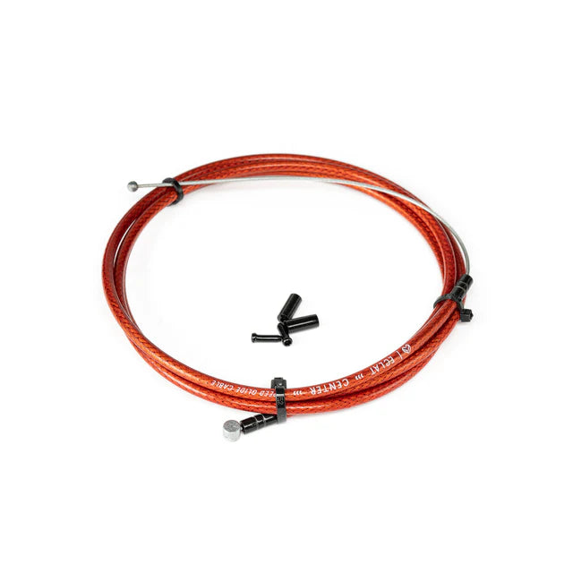 Éclat 'The Center' Linear BMX Brake Cable, translucent red finish, shown coiled with small black cable ends/ferrules included.
