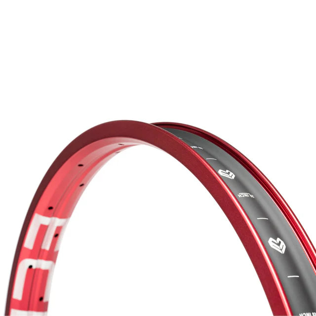 Close-up of the Éclat Trippin double-wall BMX rim in sandblast red, highlighting the ÉCLAT sidewall logo and internal markings on the rim bed.