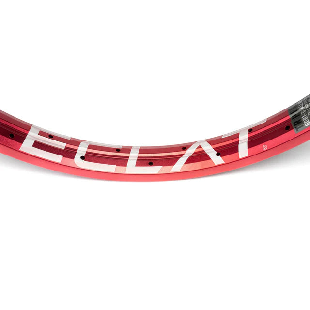 Close-up top view of the Éclat Trippin double-wall BMX rim in sandblast red, showcasing the large ÉCLAT sidewall logo and spoke holes.