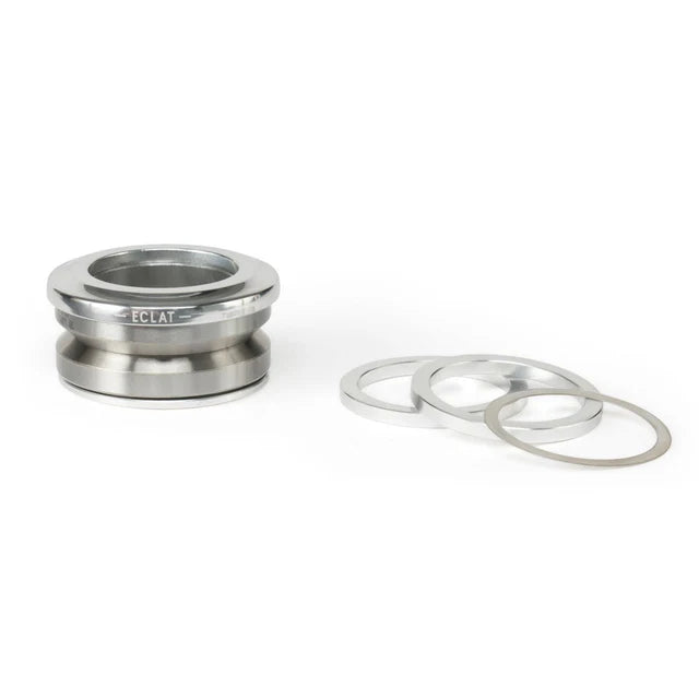 Éclat Wave 6 Integrated Headset, high polished silver finish, disassembled showing the bearings and the included aluminum and steel spacer rings.