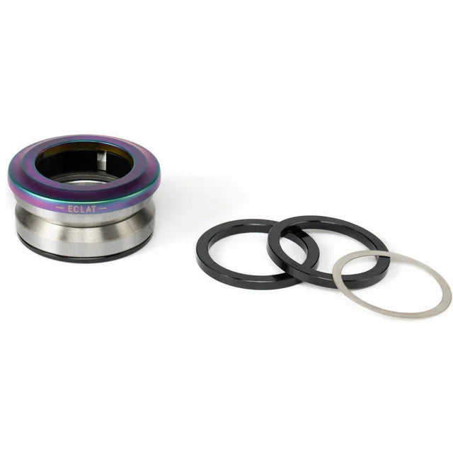 Éclat Wave 6 Integrated Headset, disassembled, featuring a satin oilslick (rainbow/neochrome) top cap and black/silver spacers.