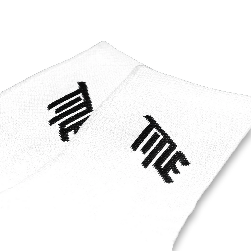 Pair of white Title MTB Everyday Socks with black logo