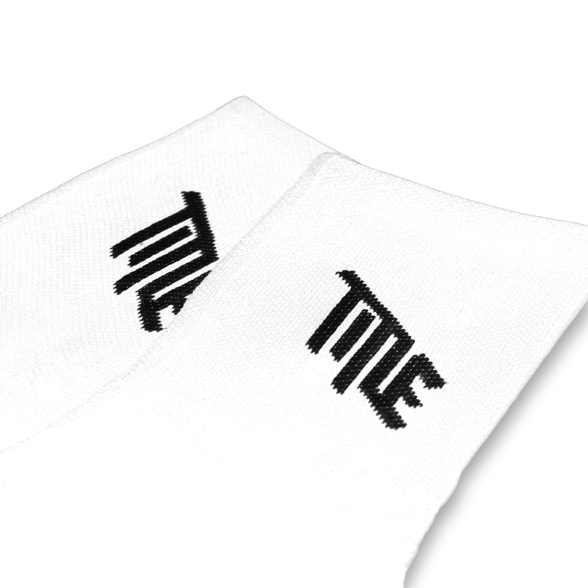 Pair of white Title MTB Everyday Socks with black logo