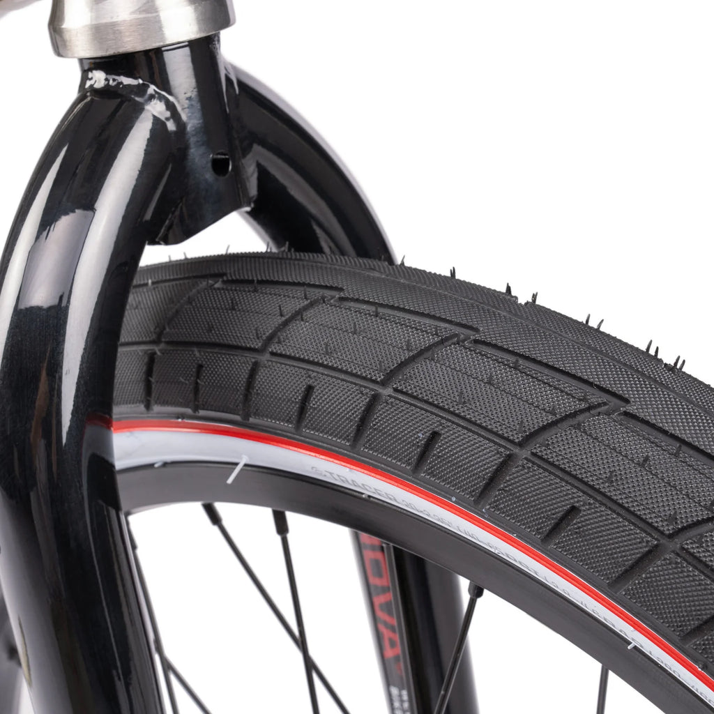 Close-up of a bicycle tire with tread pattern on a white background
