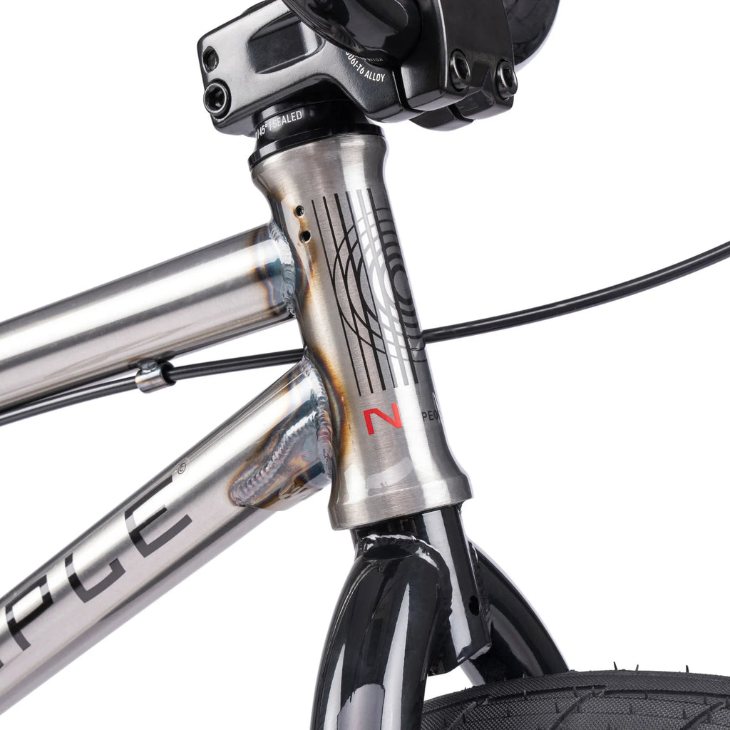 Close-up of a bicycle frame with visible branding on a white background