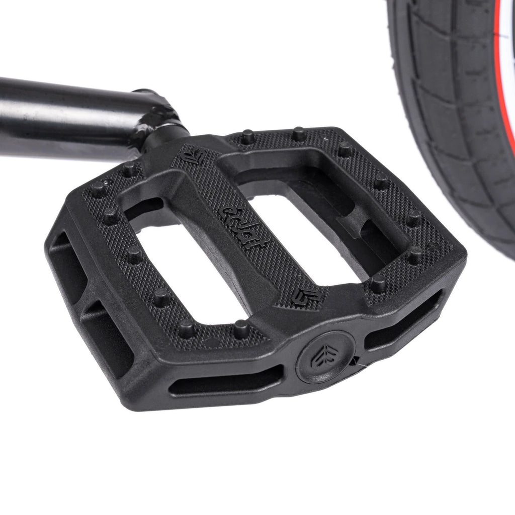Black bicycle pedal with a white background