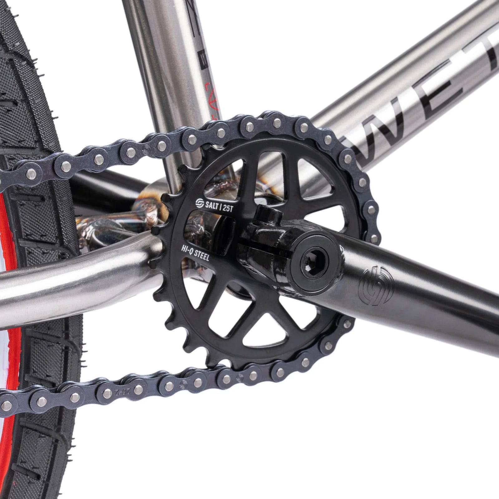 Close-up of a bicycle chain and gear system on a white background